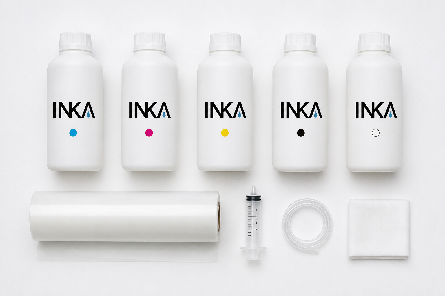 DTF inks, film roll and maintenance accessories arranged in a flat lay.
